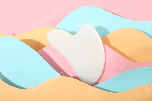 Preview: Face care concept with gua sha on multicolor background