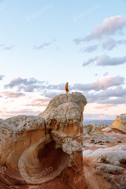 Preview: Tourist exploring White Pocket in Vermillion Cliffs, Utah, United States