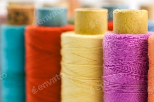 Preview: Reels or spools of multicolored sewing threads. Threads of all colors.