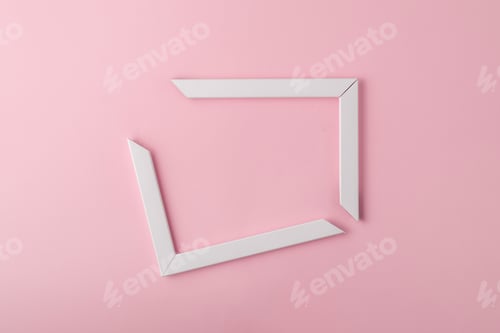 Preview: Broken white photo frame on pink background. Minimal concept.