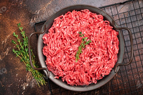 Preview: Fresh Raw pork and beef ground mince meat, mincemeat in a plate on brown background.