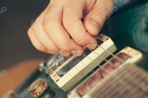 Preview: man playing electric guitar