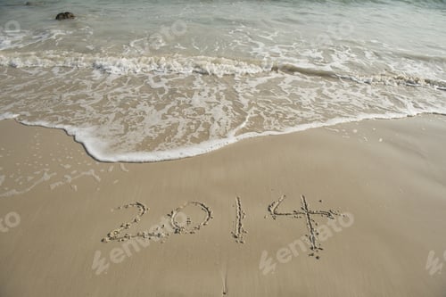 Preview: Year 2014 Hand Written On The White Sand In Front Of The Sea