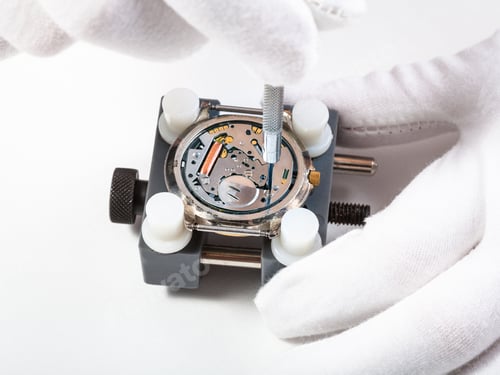 Preview: repairing quartz watch close up with screwdriver