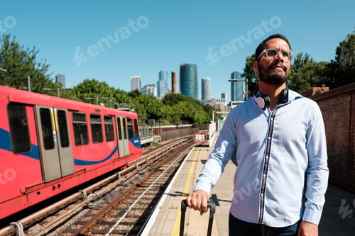 Preview: Businessman waiting for train at station in london city