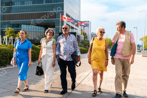 Preview: Group of senior friends meeting outddors in the city and having fun