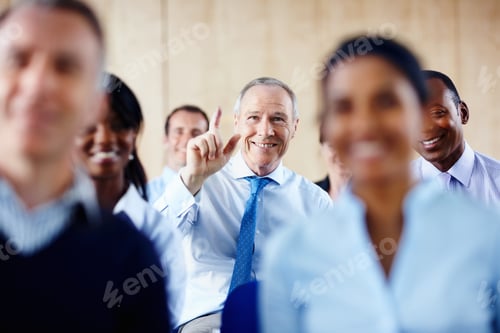 Preview: Senior executive raising his hand
