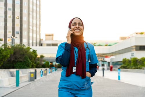 Preview: Beautiful arab nurse wearing hijab portrait in the city