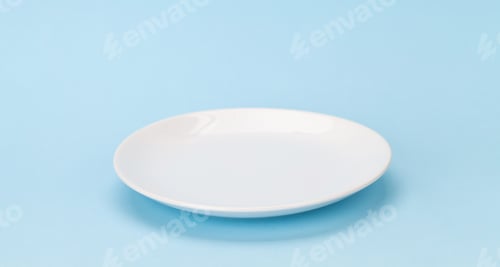 Preview: Empty white plate on blue background