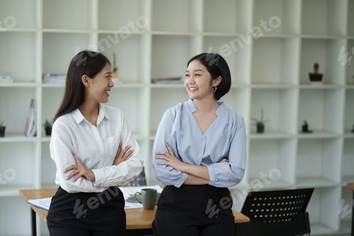 Preview: Professional Asian business team sharing ideas sitting together, discussing strategy for the