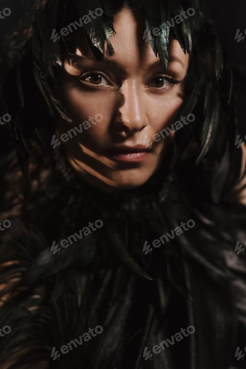 Preview: Portrait of a beautiful girl framed with black feathers