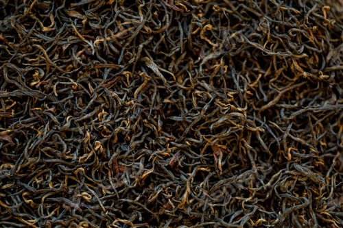Preview: Background texture of red Chinese tea. Black tea for a natural dark background