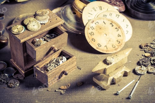 Preview: Closeup of aged watchmaker's workshop with spare parts