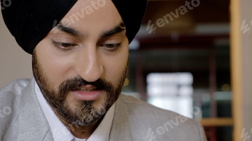 Preview: Professionally dressed South Asian man from India wearing a black turban and a suit