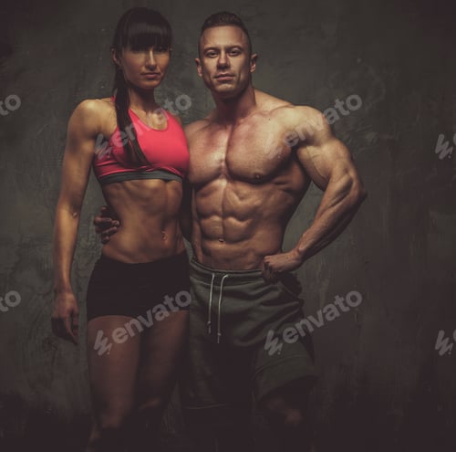 Preview: Woman and man bodybuilders posing in studio