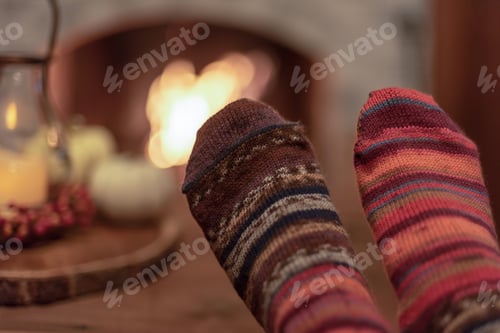 Preview: Wearing cozy hand knit socks by the fire