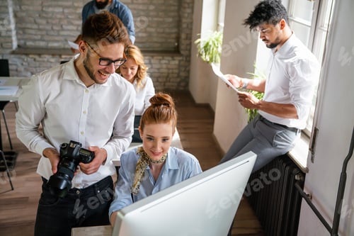 Preview: Creative startup young multiethnic business people working together at designer agency in office