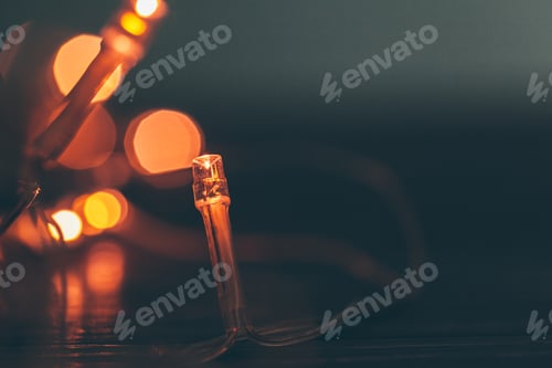 Preview: Illuminated garland close up on dark background