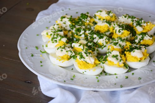 Preview: Freshly made Deviled eggs on a large white plate
