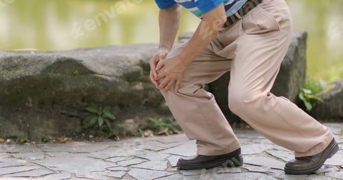 Preview: Old man suffer from pain on legs at outdoor