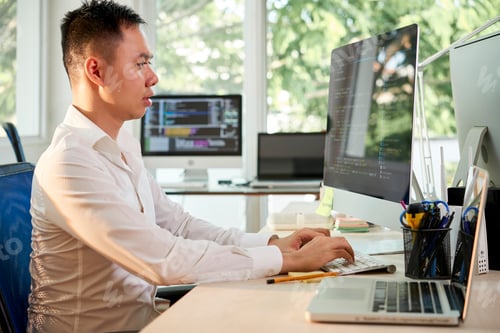 Preview: Programmer Coding on Computer