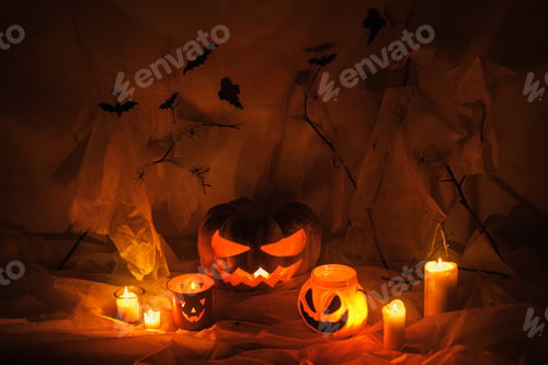 Preview: Happy Halloween! Spooky Jack o lantern carved pumpkin, spider web, ghost, bats and glowing light