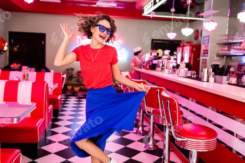 Preview: stylish smiling woman in retro vintage cafe