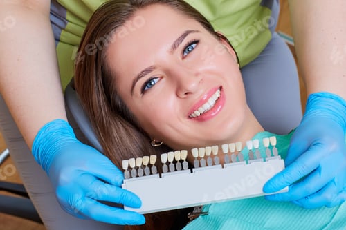 Preview: Close-up of a girl with a beautiful smile at the dentist. Dental care concept.