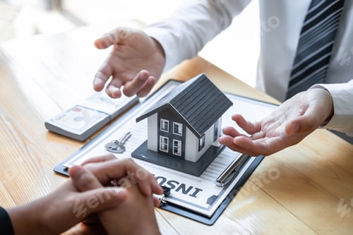 Preview: Estate agent are presenting home loan and giving house to client after discussing and signing