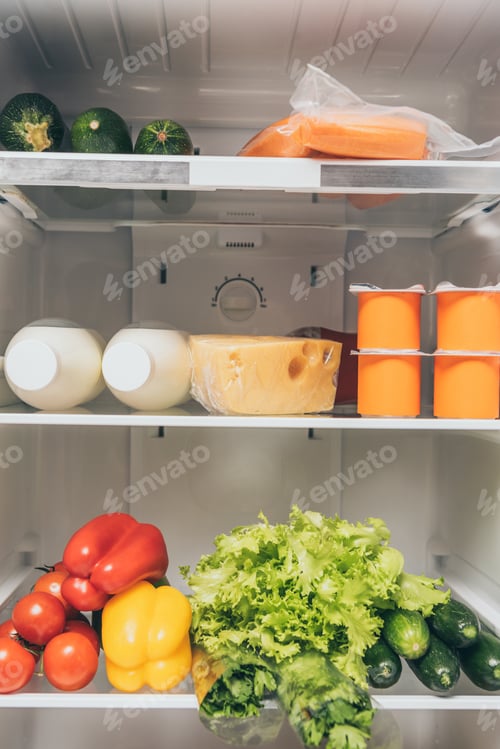Preview: open fridge full of fresh food on shelves