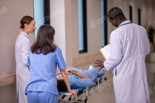 Preview: medics and patient on hospital gurney at emergency