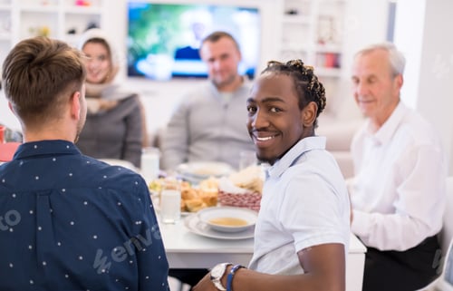 Preview: black man enjoying iftar dinner with family