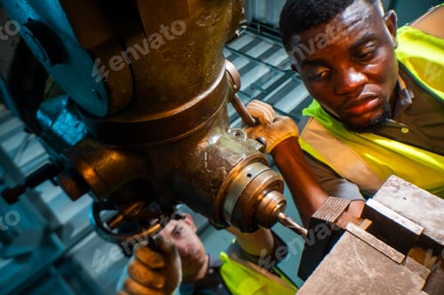 Preview: experienced technician operates a machine in a factory setting,