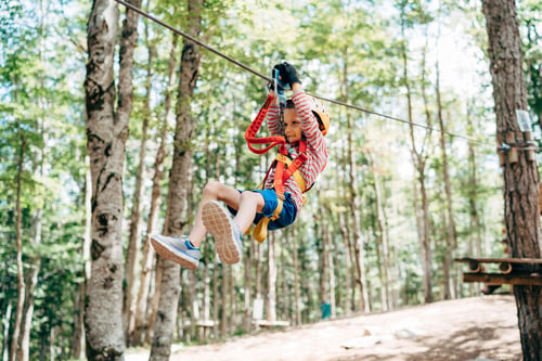 Preview: Boy goes down the zip line in the adventure park