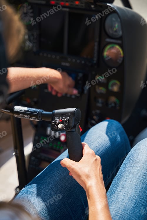 Preview: Licensed female pilot preparing for helicopter flight