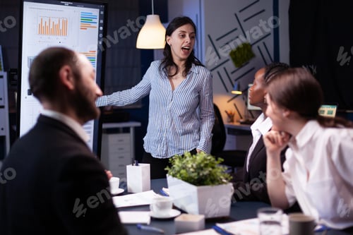 Preview: Workaholic focused businesswoman explaining management solution pointing strategy on monitor
