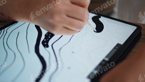 Preview: Designer hand sketching pad remote workplace closeup. Artist fingers drawing pen