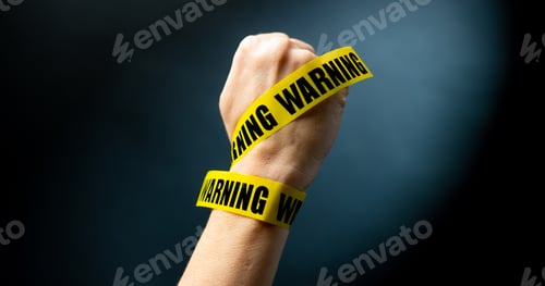 Preview: Hand with warning tape shows signs