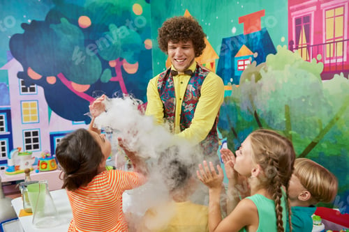 Preview: Animator with happy children indoor.