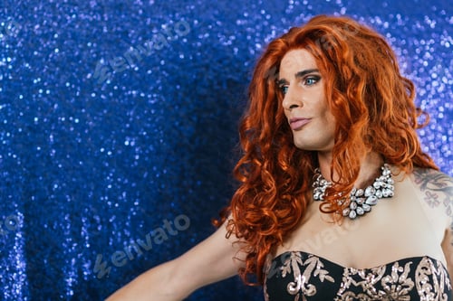 Preview: Beauty drag queen on stage with a blue background