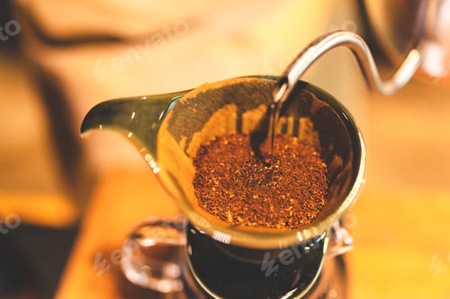 Preview: Asian hipster barista working to make a coffee by slow bar process, coffee filter or drip brewing