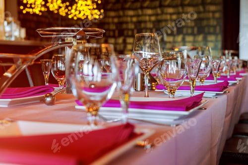 Preview: Glasses, flower fork, knife served for dinner in restaurant with cozy interior