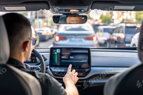 Preview: A male driver drives at speed through the streets of the city.
