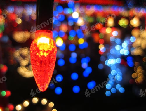Preview: Pretty colorful bokeh Christmas lights. Festive background with copy space. Depth of field.