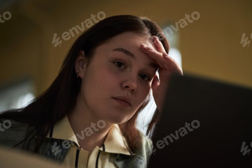 Preview: Portrait of Caucasian Young Adult Woman Studying with Laptop Looking Stressed