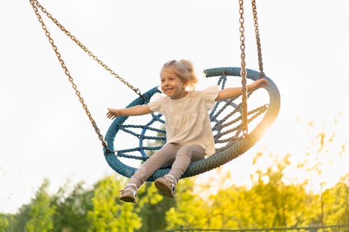 Preview: Little girl swings on a big swing, high flight and emotions of happiness
