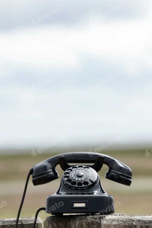 Preview: Old retro phone outdoors with copy space