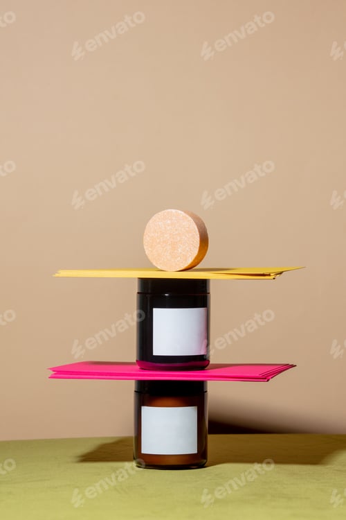 Preview: Two jars, soap and envelopes on brown background