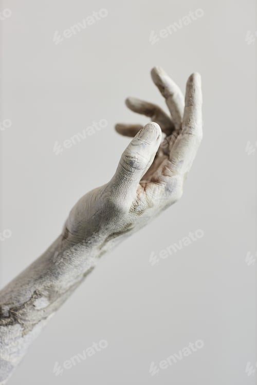 Preview: Hand covered in white paint,