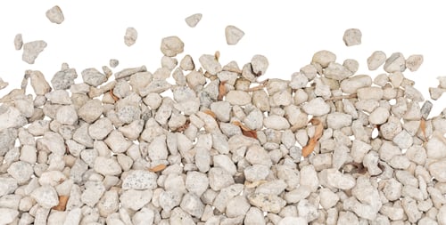 Preview: Small white stones are seen scattered on a white background.